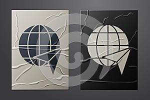 White Globe with flying plane icon isolated on crumpled paper background. Airplane fly around the planet earth. Aircraft