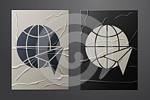 White Globe with flying plane icon isolated on crumpled paper background. Airplane fly around the planet earth. Aircraft