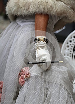 white glovers with the cigarette holder and vintage style dress