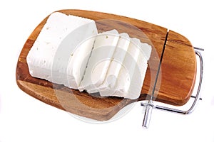 White goat cheese and slice on wooden plate