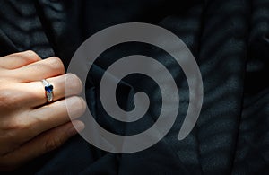 White gold diamond ring  on black fabric background