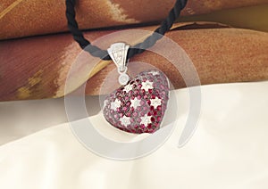 White Gold Heart Shaped Pendant With Rubies And Diamonds
