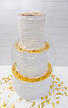 White and gold paper wedding cake, piÃ±ata cake.