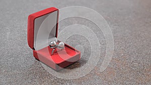 White gold ring with pearls in red box