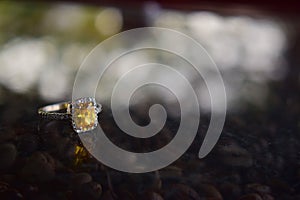 White gold ring set with yellow gemstone Surrounded by diamonds Luxury wedding ring