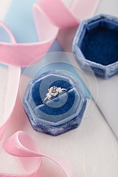 White golden wedding ring with diamonds in blue vintage velvet b