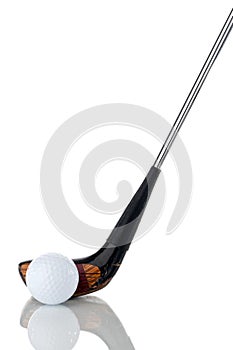 White golf ball and club on reflective white