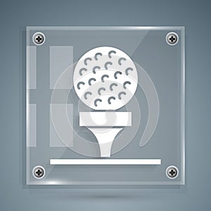 White Golf ball on tee icon isolated on grey background. Square glass panels. Vector