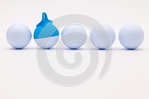 White golf balls with funny cap on the white background.