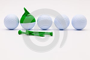 White golf balls with funny cap on the white background.