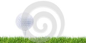 White golfball on tee in green