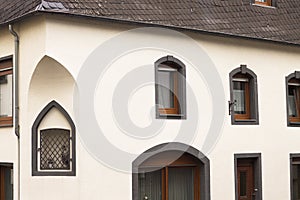 White gothic house with black roof tiles Germany