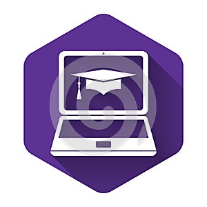 White Graduation cap and laptop icon. Online learning or e-learning concept icon isolated with long shadow. Purple