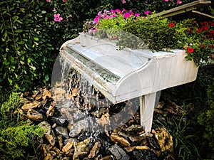 White grand piano water fountain