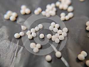white granules on black surface
