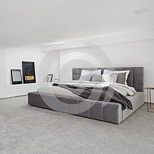 White and gray bedroom with big bed