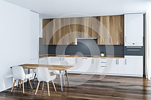 White and gray kitchen corner with table