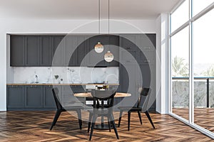 White and gray kitchen interior, balcony, table