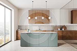 White and gray kitchen interior with island and wooden cupboards