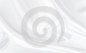 White gray satin texture that is white silver fabric silk background with beautiful soft blur pattern .
