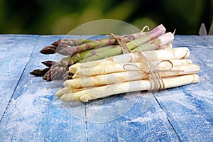 White and green asparagus on vintage old background