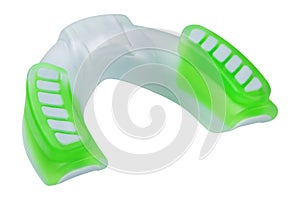 White with green inserts silicone mouthguard for one jaw, lies on the reverse side, on a white background