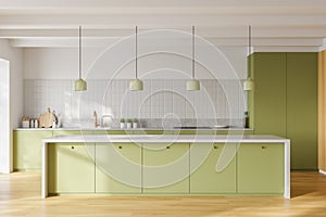 White and green kitchen interior with island