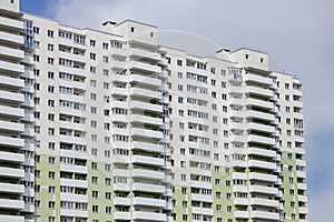 High multistoried apartment building in residential city district, urban background photo