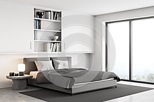 White and grey bedroom, bed with linens and bookshelf near window