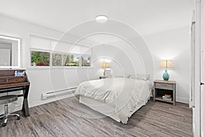 White and grey bedroom with a freestanding makeup vanity