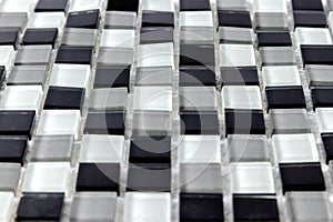 White, Grey and black ceramic mosaic wall tiles texture for bathroom, abstract background for copy space, side view
