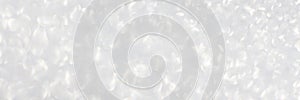 White and grey glitter bokeh circle glow blurred and blur abstract. Glittering shimmer bright luxury.