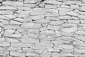 White grey stone wall texture in natural pattern for background and design art work