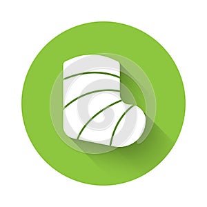 White Gypsum cast medical health broken leg icon isolated with long shadow. Green circle button. Vector