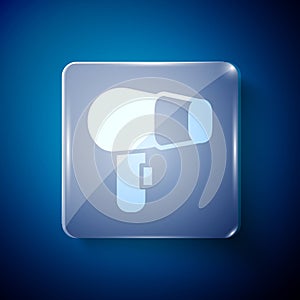 White Hair dryer icon isolated on blue background. Hairdryer sign. Hair drying symbol. Blowing hot air. Square glass