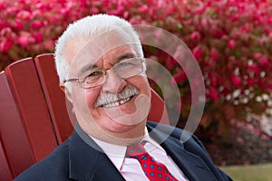 White Hair Senior Businessman Outside Smiling at Y