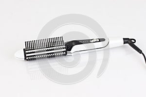 White hair straightener with comb photo