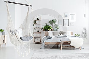 White hammock in bedroom interior