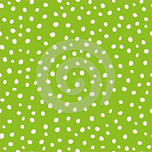 White hand drawn circular paint dots in scattered design. Seamless vector pattern on green background. Great as