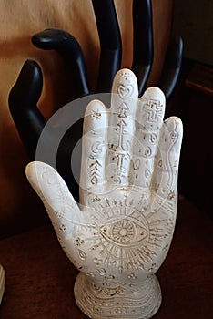 white hand with psychic readings, and a black hand in the OK sign