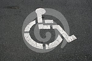 White Handicapped Symbol On Pavement