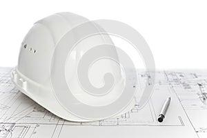 White hard hat on construction plan