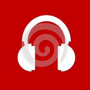 White headphones icon. Vector headphones pictogram. Vector illustration isolated on red background photo