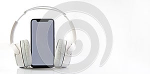 White headphones on smartphone music online concept, mockup, isolate on white