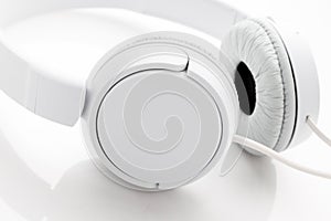 White headphones on white background