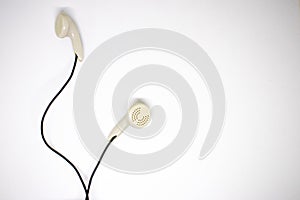 White headphones on a white background.Digital music concept.Close-up
