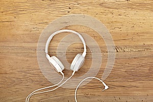 White headphones on wood