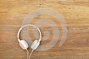 White headphones on wood