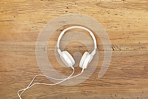 White headphones on wood