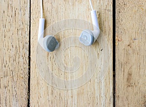 White headphones on wood